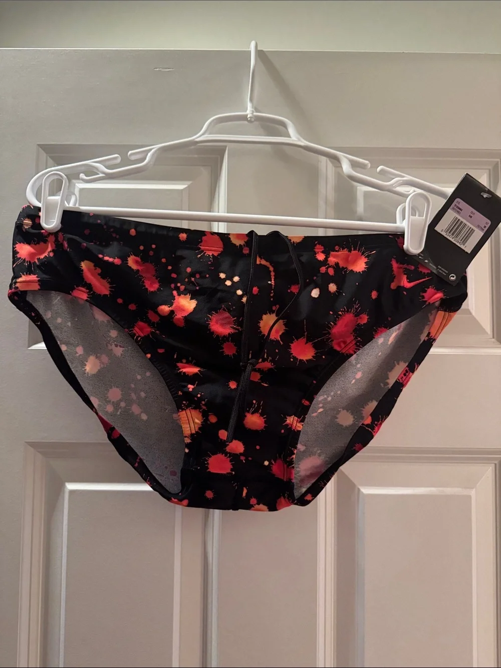 Nike Men’s Black Swim Briefs with Red and Orange Splatter Size 38.